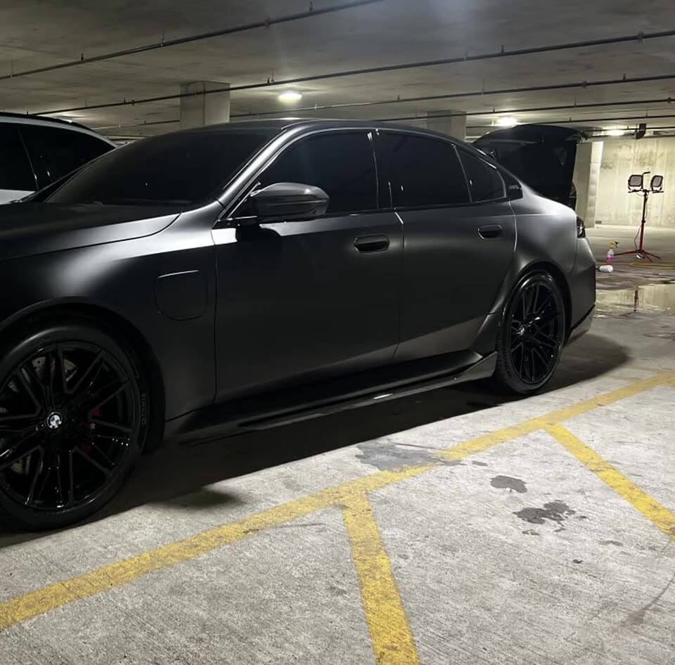 Matte black BMW sedan detailed by The Gloss Spot, Champaign IL